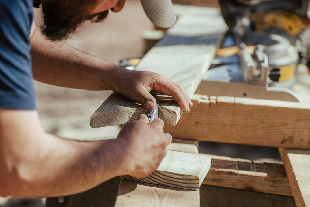traditional carpenter using hand tools