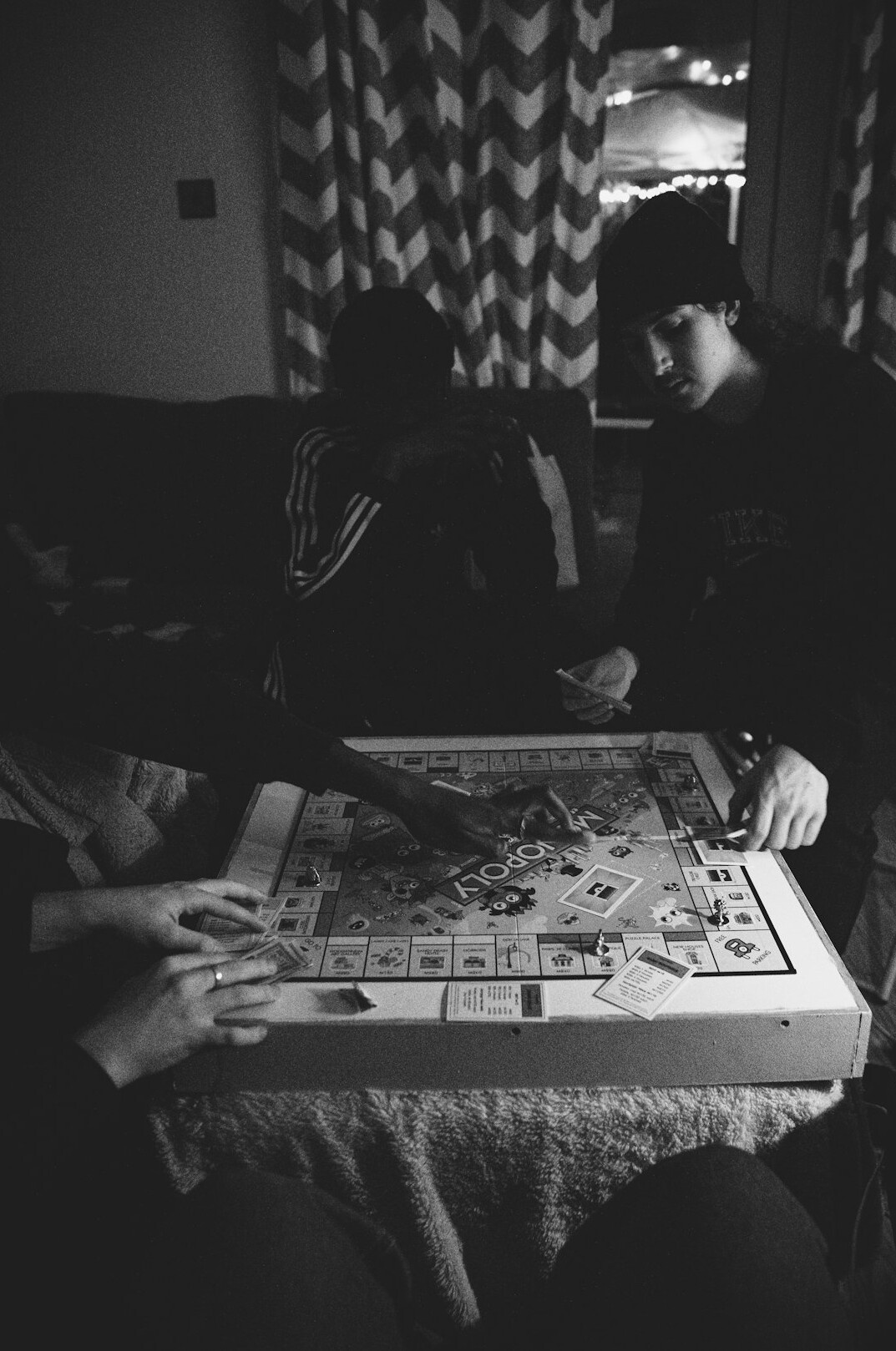 family playing board game
