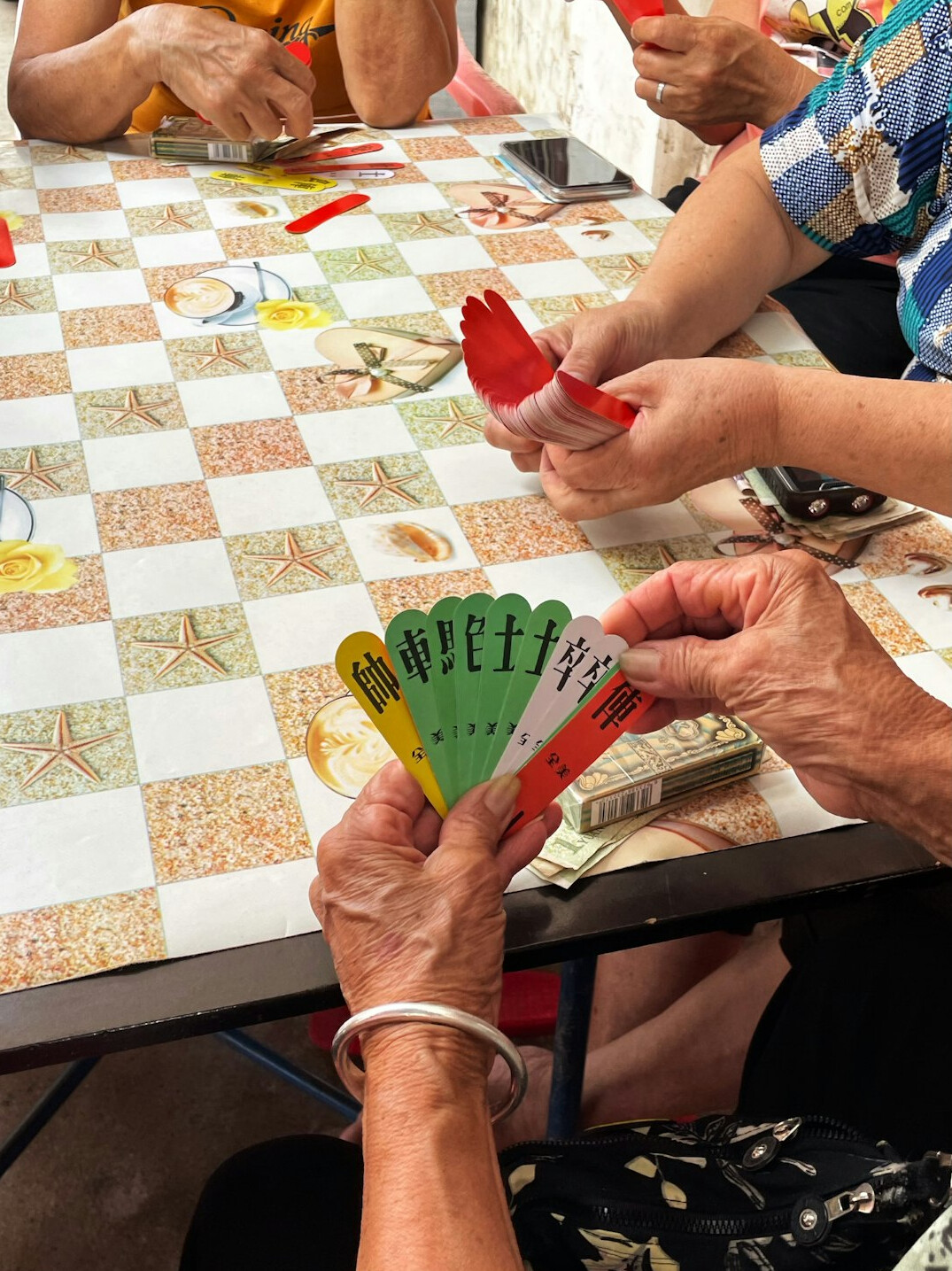 elderly person teaching stamp collecting