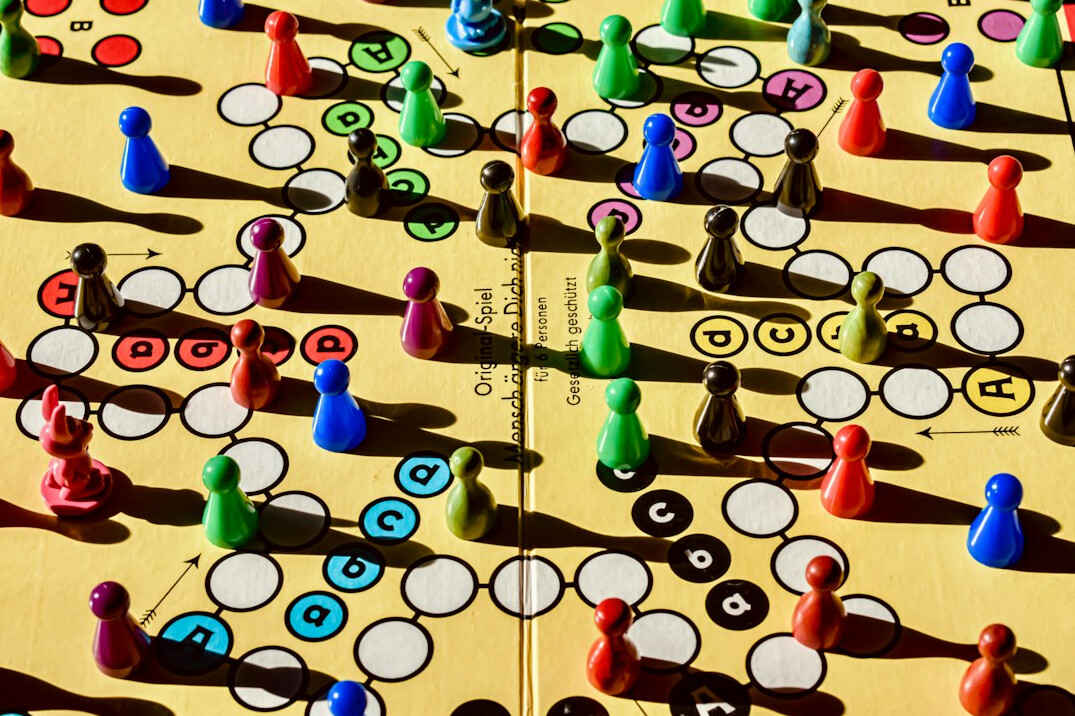 family playing board game